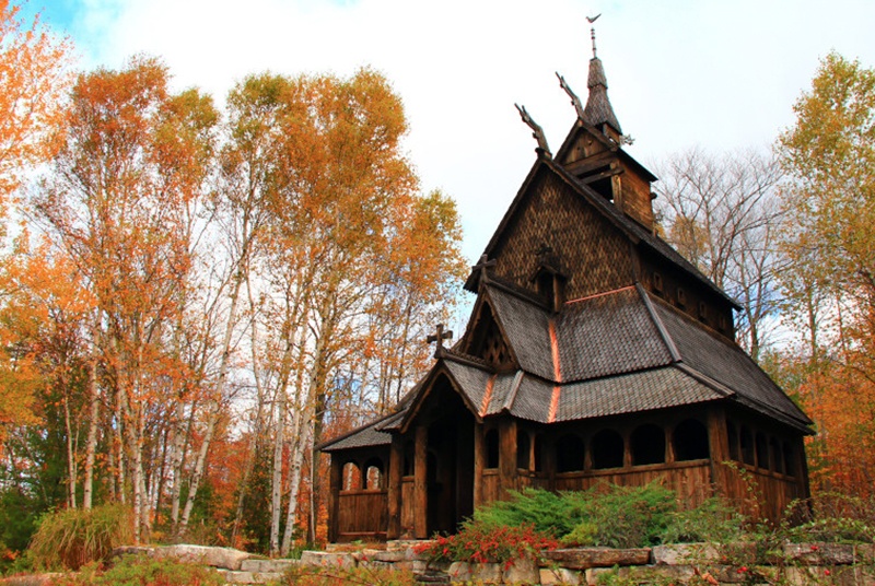 Wooden building surrounded by trees in their fall colors