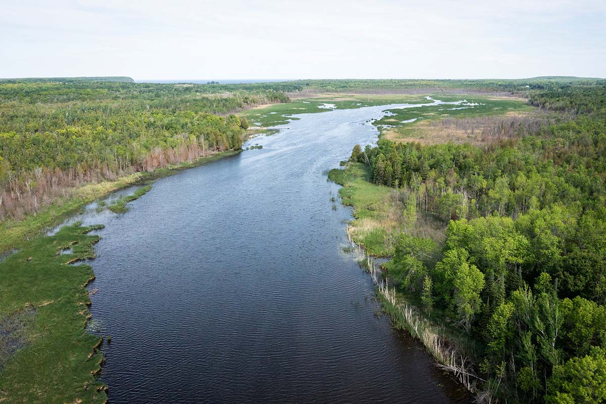 A view down the Mink River as it feeds toward Lake Michigan.