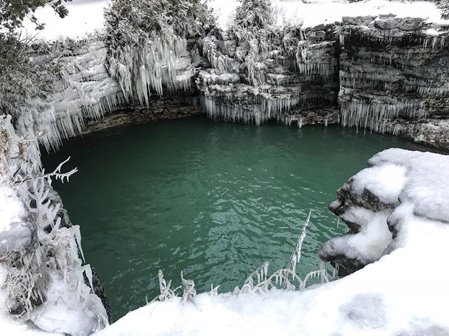 Snowy and icy cliffside along the lake