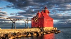 Red building at the end of a peninsula