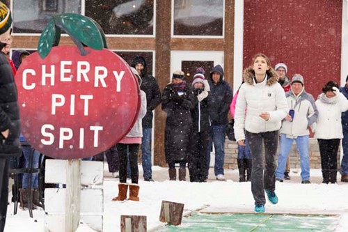 A young man attempts the Cherry Pit Spit in winter.