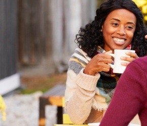 Woman enjoying a cup of coffee.