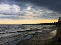 Stormy sunset sky over the lake