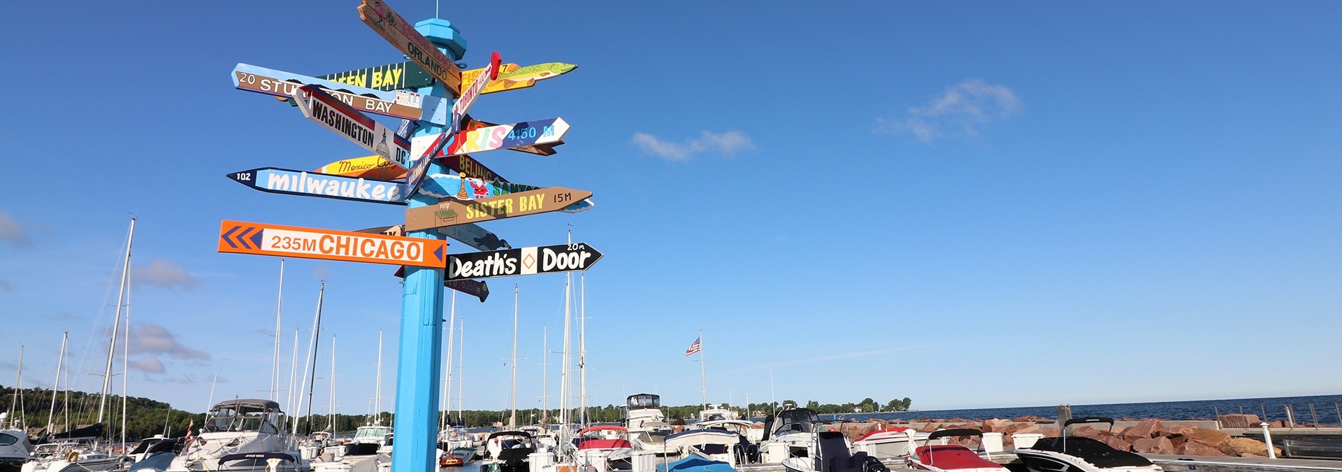 Colorful signposts with signs pointing in different directions