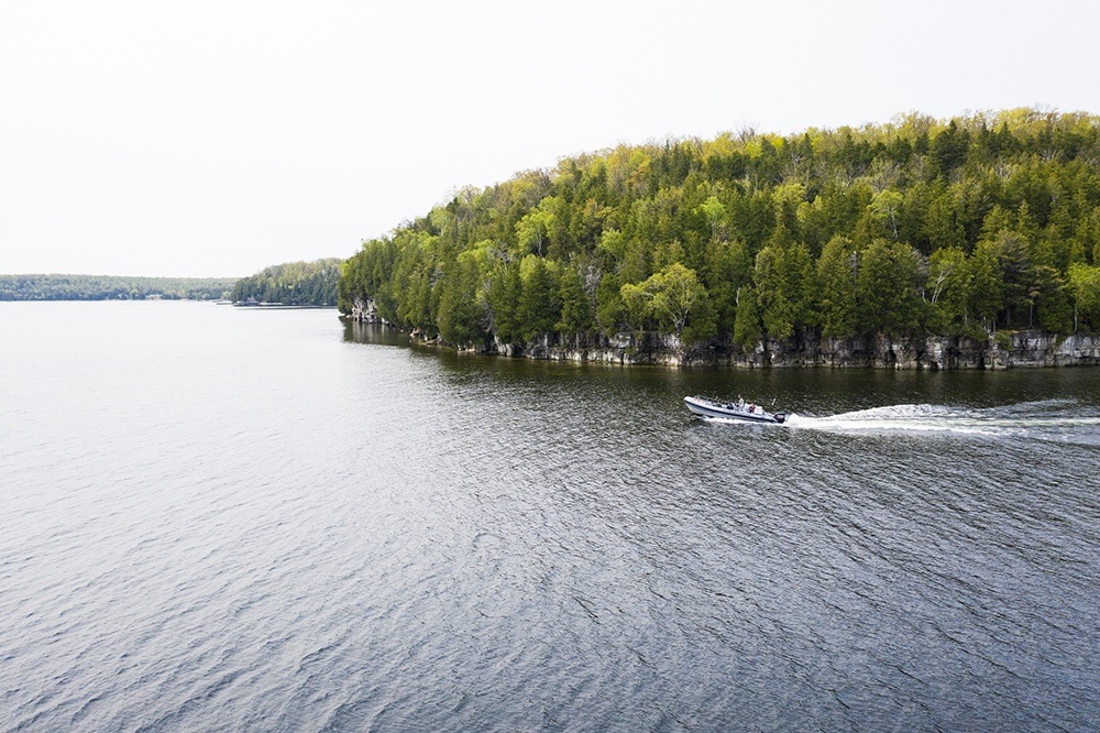 Boat driving near escarpment