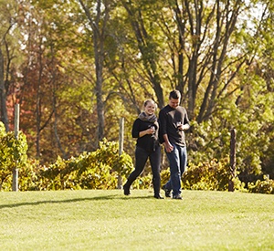 A couple holding hands and walking