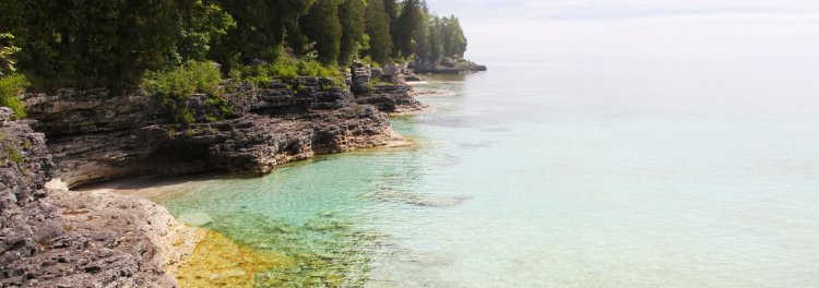 Clear calm water at the lakefront.