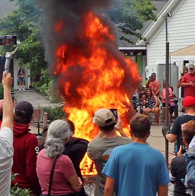 People by the fire at a fish boil