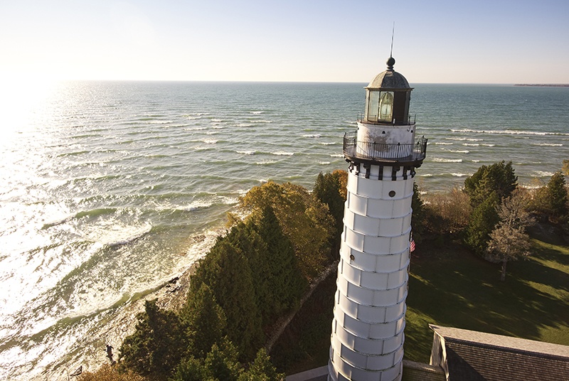 White lighthouse on the edge of the lake