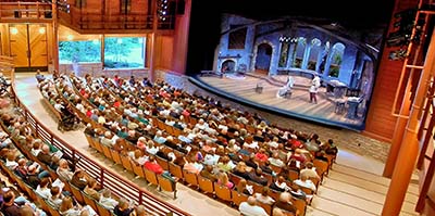 An audience watching a performance on stage.