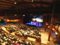 An audience watching a performance on stage.