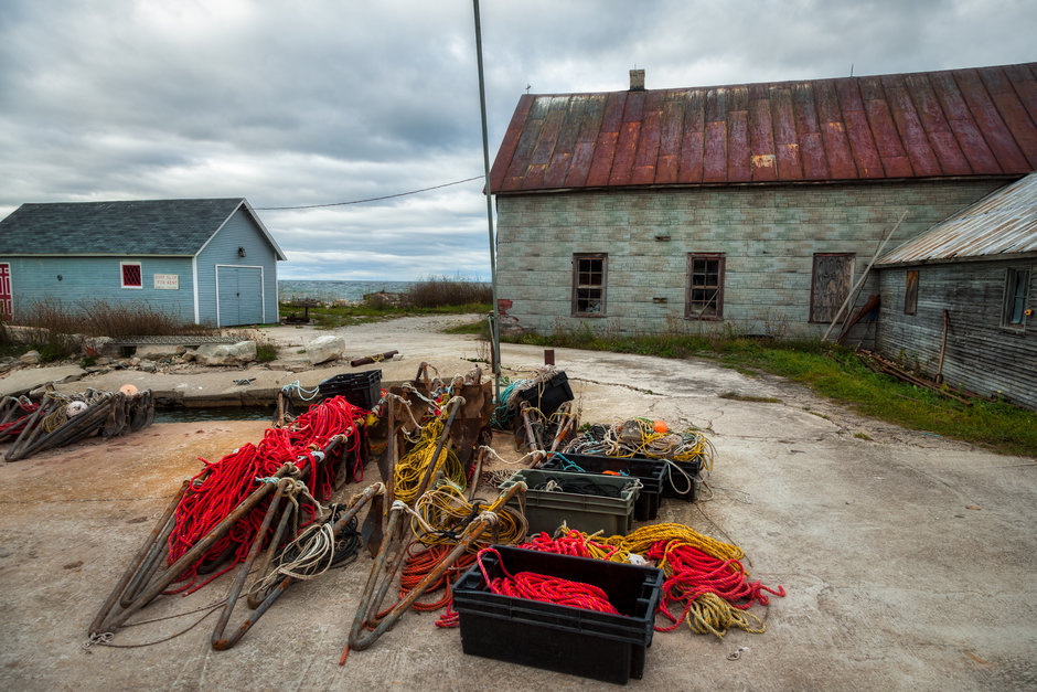 Fishing nets laid out on the ground.