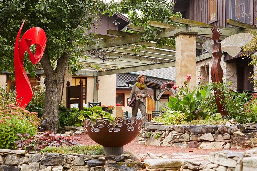 A person walking through a garden.